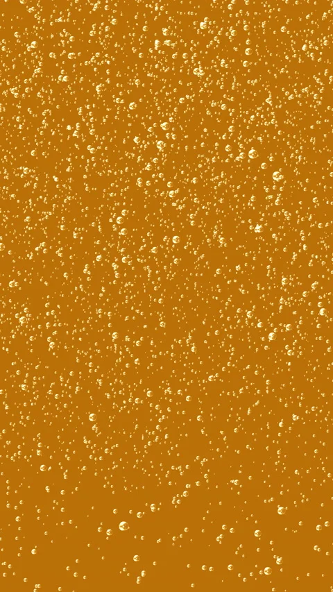Small bubbles rising in golden liquid Stock Footage 233455442