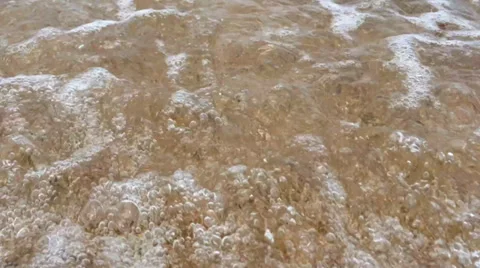 Small Bubbling Waves Over Shelly Beach Stock Footage 33892874