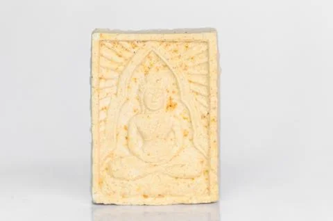 Small buddha reflect on white background Stock Photos
