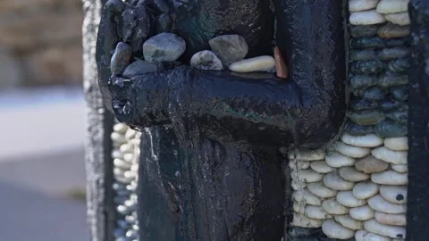 Small Buddha statue on the background of a small waterfall Stock Footage 263187699