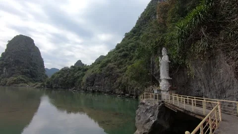 Small Buddha statue in a beautiful mountainous remote area in Halong Bay Stock Footage 172243022