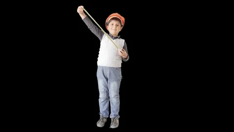 A small builder in a helmet and with a tape measure Stock Footage 75672223
