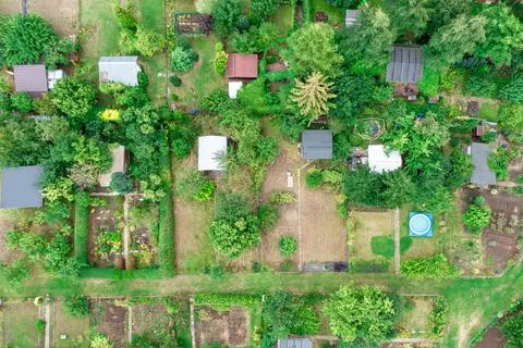 Small buildings on a personal plot, vegetable garden, top view, summer landsc Stock Photos