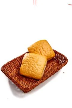 Small buns lie in the bread basket Stock Photos