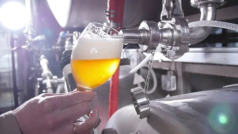 Small business and manufacturing concept. Craft beer brewing equipment in Stock Footage