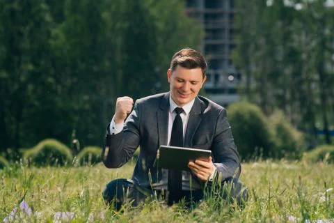 Small business concept, freelancer man copying space on the right, raised his Stock Photos