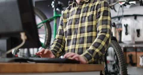 Small business owner using computer in a store Stock Footage 87904328