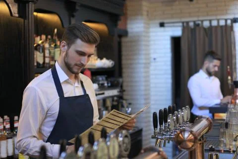Small business owner working at his cafe. Foto stock