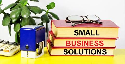 Small business solutions. Text label in on textbooks. Stock Photos