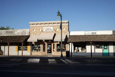 Small business store fronts on empty street Stock Photos