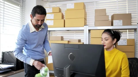 Small business team checking inventory together Stock Footage 326278646