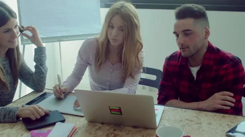 Small business team working in the startup office Stock Footage 62948933