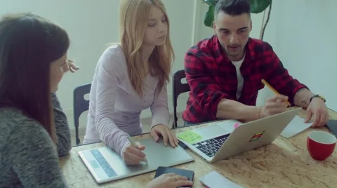 Small business team working in the startup office Stock Footage 62948960