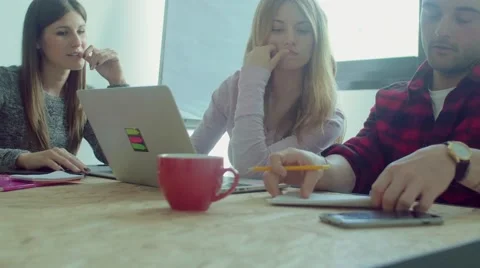 Small business team working in the startup office Stock Footage 62949079