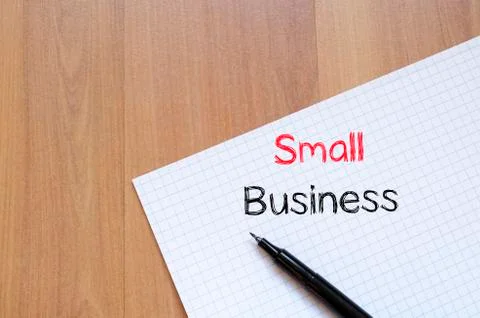 Small business text concept on notebook Stock Photos