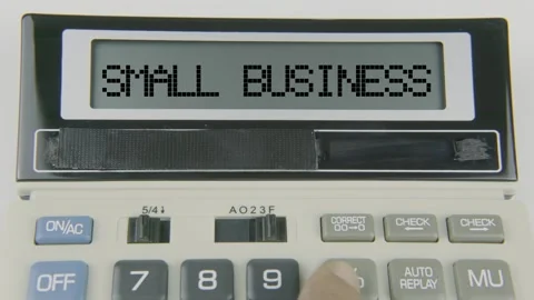 Small Business Text or Words and Hand Typing  Concept Calculator Stock Footage 307054617