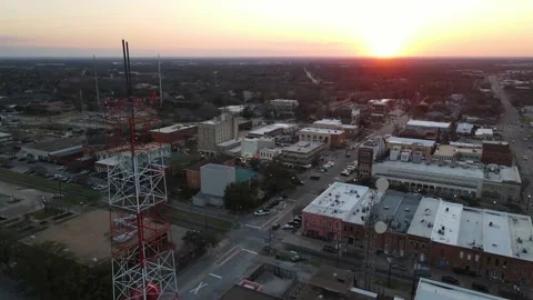 Small, bustling Texas town drone at sunset Stock Footage 208427006