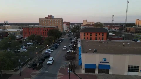 Small, bustling Texas town drone at sunset Stock Footage 208427010