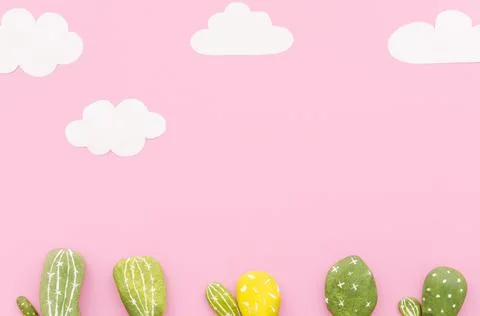 Small cactuses with paper clouds table. High quality and resolution beautiful Stock Photos