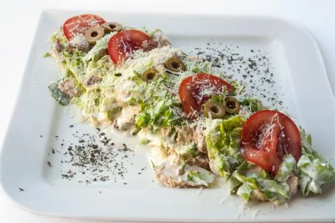 A small Caesar Salad with shredded parmesan cheese, croutons and Stock Photos