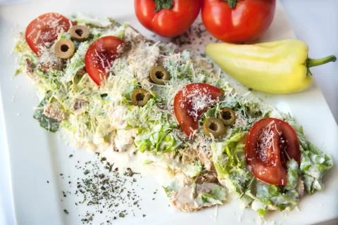 A small Caesar Salad with shredded parmesan cheese, croutons and Stock Photos
