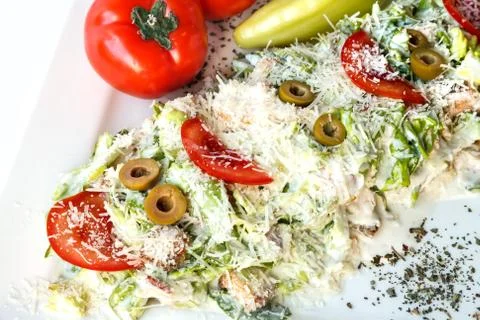 A small Caesar Salad with shredded parmesan cheese, croutons and Stock-Fotos