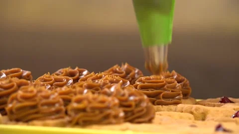 Small Cakes being prepared by a professional Stock Footage 239695760