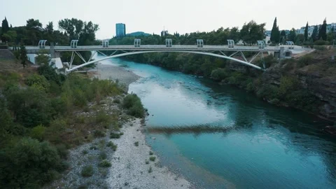 A small calm river flows under the bridge Stock Footage 201607373