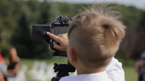 Small cameraman captures nature Stock Footage