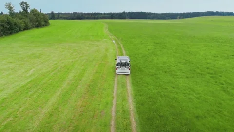 Small camping van with bike rack on country road Stock-Footage 133763594