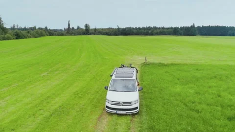 Small camping van with bike rack on country road Video stock 133933254