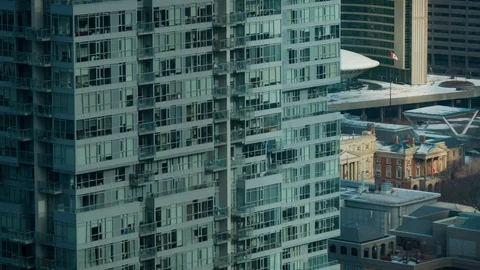 Small Canadian Flag in between office buildings in Winter Stock Footage 101442334