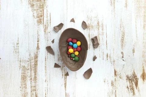 Small candies open chocolate egg table 写真素材