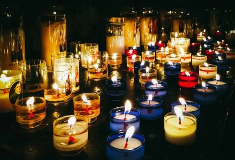 Small candles in the dark Stock Photos