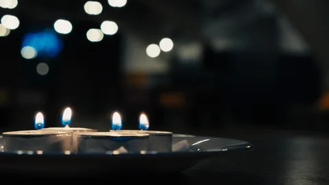 Small candles floating in the darkness warm tones Stock-Footage 124842800