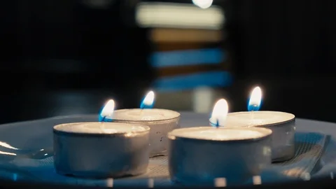 Small candles floating in the darkness warm tones Stock Footage 124846026