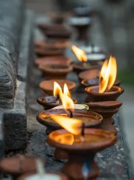 Small Candles on Stone Ledge, Prayer Candles, Terra Cotta Stock Photos