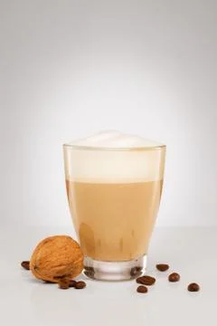 Small cappuccino with a walnut Stock Photos