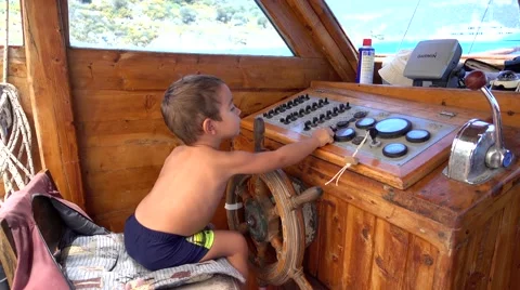 Small captain at the wheel, Crystal child Stock Footage 66860059