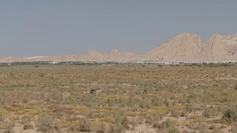 Small Car in Desert Stock Footage 329411399