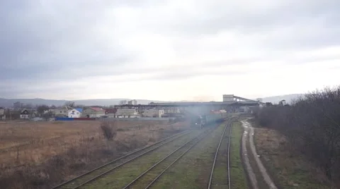 Small cargo train with wagons is removed Stock Footage 64650703