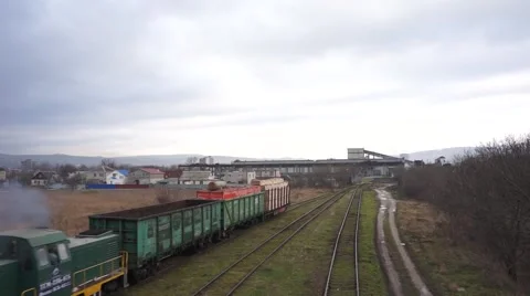 Small cargo train with wagons is removed Stock Footage 64650705