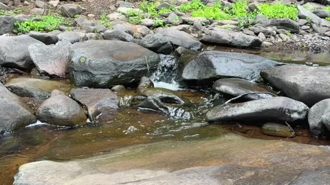 Small Cascade Flowing Between Smooth River Rocks in Burnt Meadow Brook, New  Stock Footage 340986812