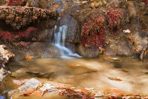 Small cascade on mountain stream Stock Photos