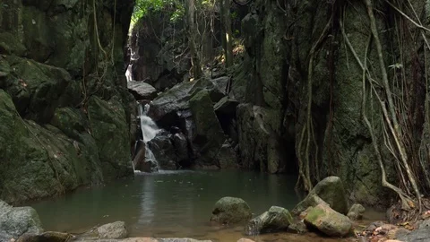 Small cascade or water flowing over rocks on background. Amazing peaceful nature Stock Footage 94408057