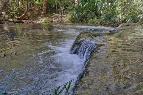 A small cascade of water in the forest Stock Photos