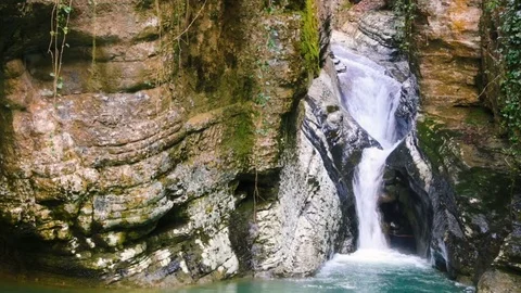 Small cascade waterfall and rock in nature Stock-Footage 84858043
