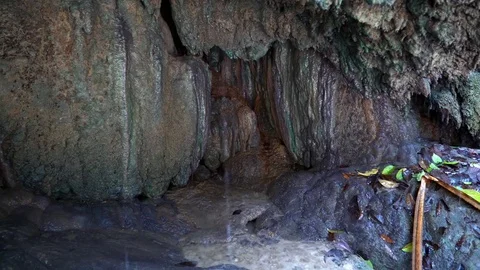 A Small Cave Under a Waterfall Stock Footage 74290676