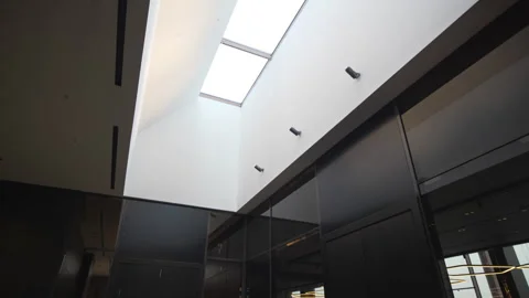 Small ceiling window brings daylight into hotel hall Stock Footage 324910529