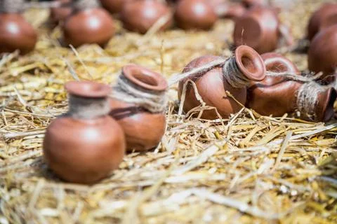 Small ceramic crocks or pot on straw Stock Photos